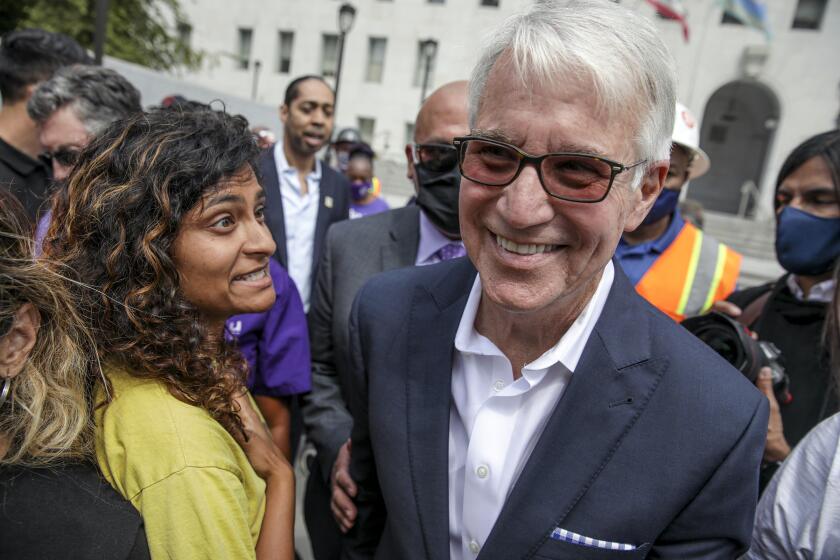 Los Angeles, CA - June 18: Los Angeles District Attorney George Gascon, mingles with the attendees of a press conference held on the steps of Hall of Justice on Friday, June 18, 2021 in Los Angeles, CA. (Irfan Khan / Los Angeles Times)