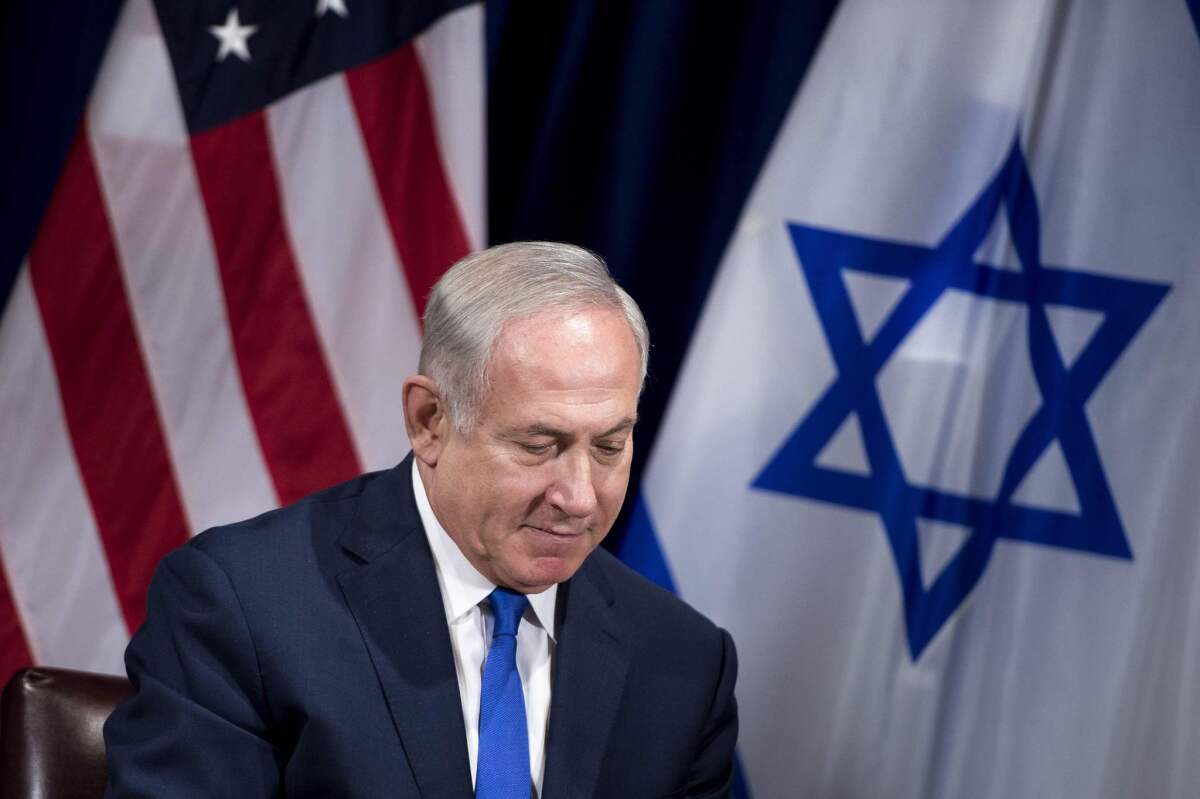 Israeli Prime Minister Benjamin Netanyahu faces reporters before a meeting with President Trump.