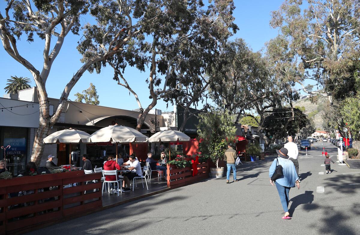 Patrons eat in a parklet in downtown Laguna Beach in January 2022. 