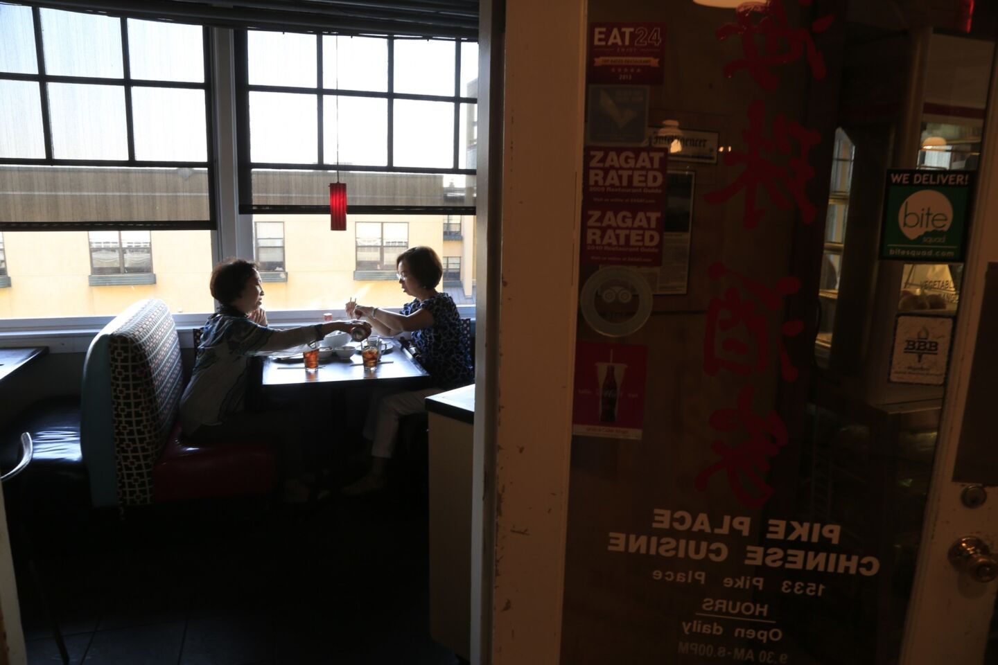 Customers dine inside the tiny Pike Place Chinese Cuisine.