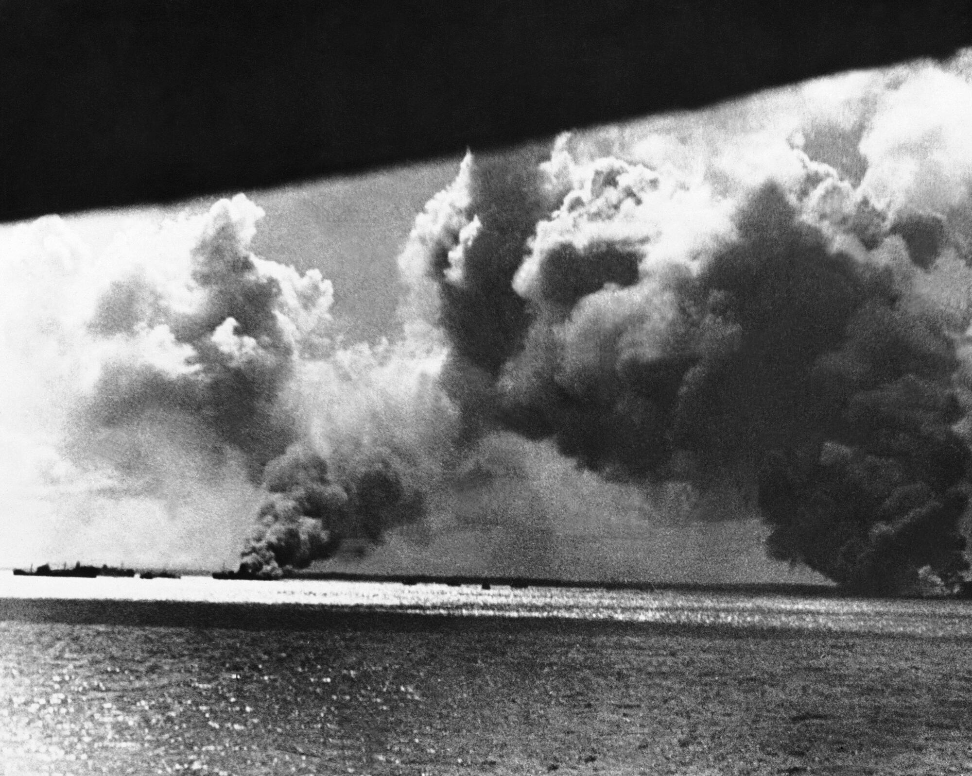 Smoke billowing from Darwin, Australia, after Japanese aerial attack in 1942
