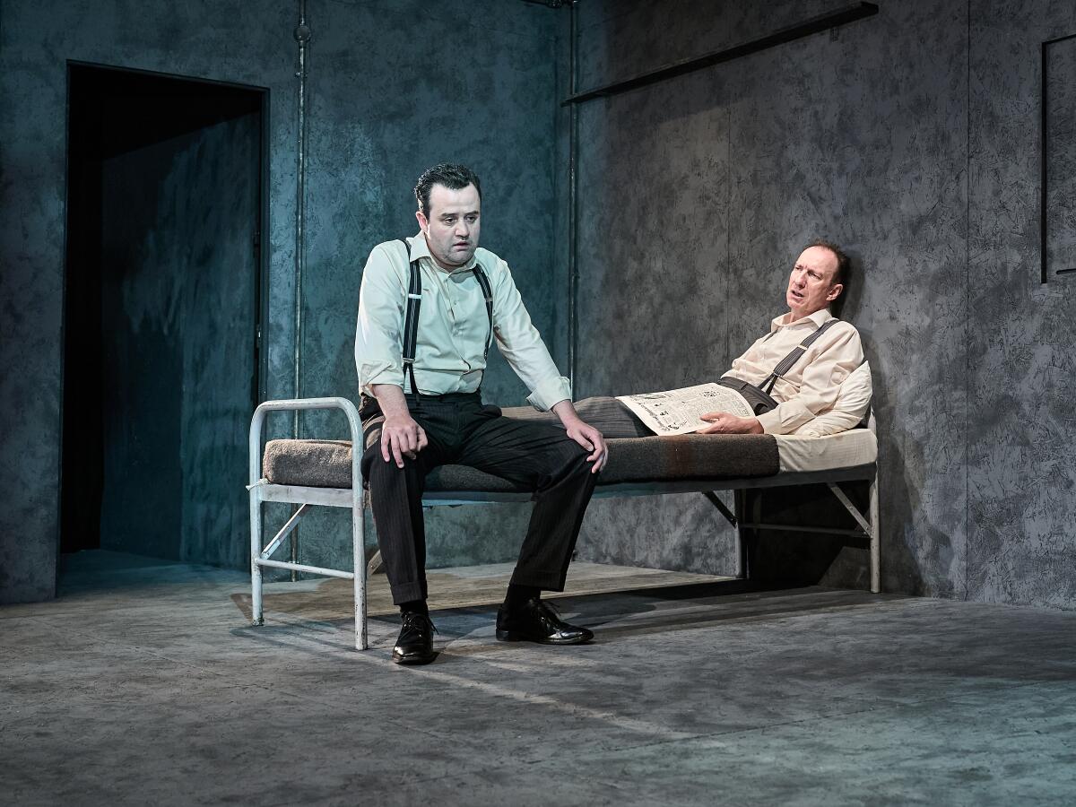 Daniel Mays and David Thewlis sit on a bed in Harold Pinter's 'The Dumb Waiter' at the Old Vic.