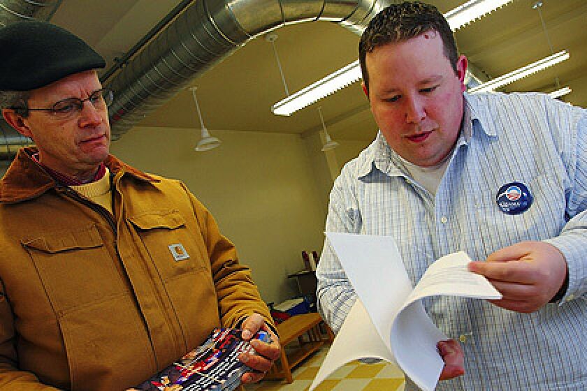 Josh Pedaline, right, of Columbus, Ohio trains John Hughes in canvassing for the Barack Obama campaign on Sunday February 24, 2008 at the Delaware County Obama campaign headquarters in Delaware, Ohio.