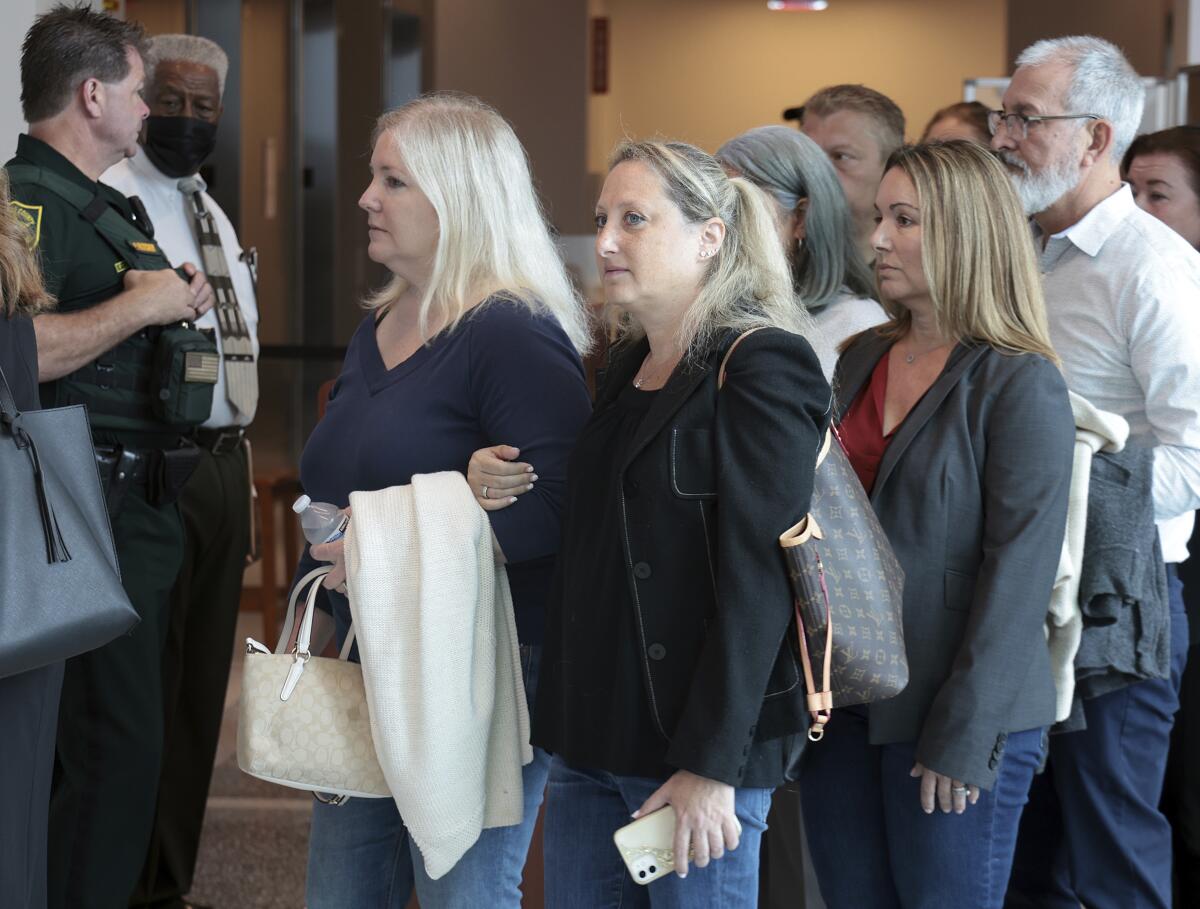 On Monday, July 18, 2022 relatives and family members arrive on the first day of the sentencing trial for convicted Parkland school shooter Nikolas Cruz at the Broward County Judicial Complex in downtown Fort Lauderdale, Fla. (Carl Juste/Miami Herald via AP, Pool)
