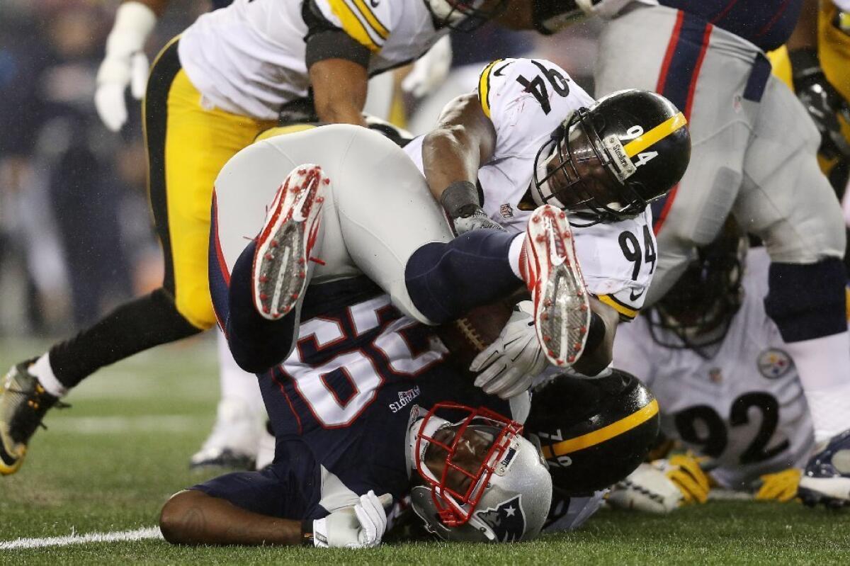 Patriots running back LeGarrette Blount (29) is tackled by Steelers' Javon Hargrave (79) during the first quarter in the AFC Championship Game on Jan. 22.