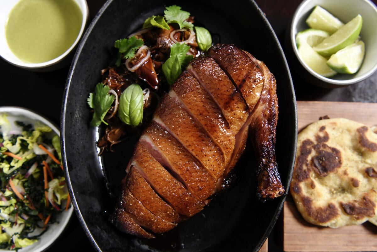 The honey-glazed half duck at NoMad has dense, crackly skin which is at least half the joy of consuming it.