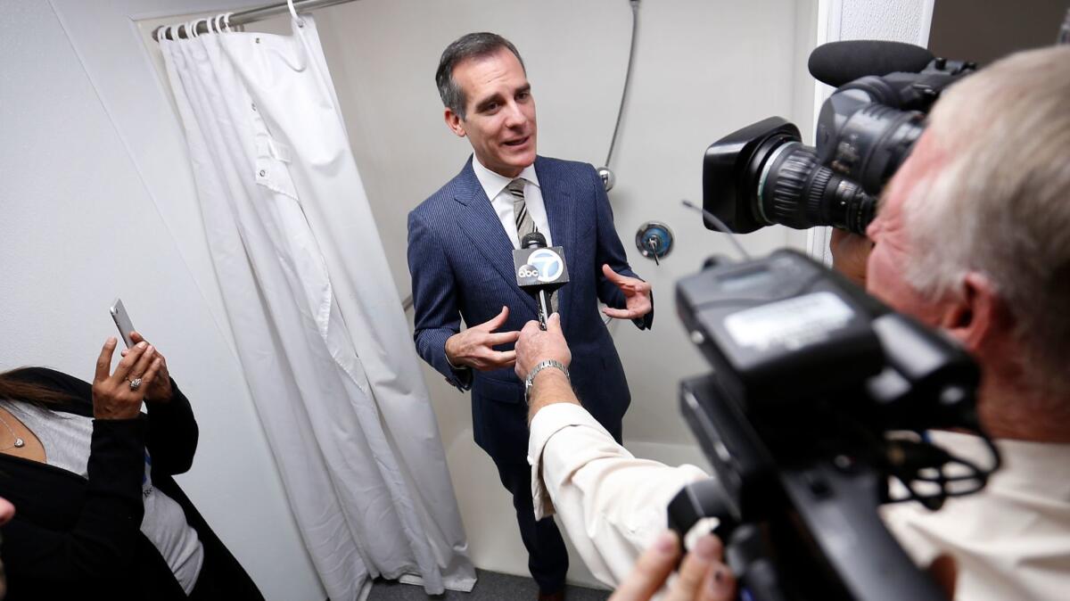 L.A. Mayor Eric Garcetti tours a new hygiene facility for people on skid row.