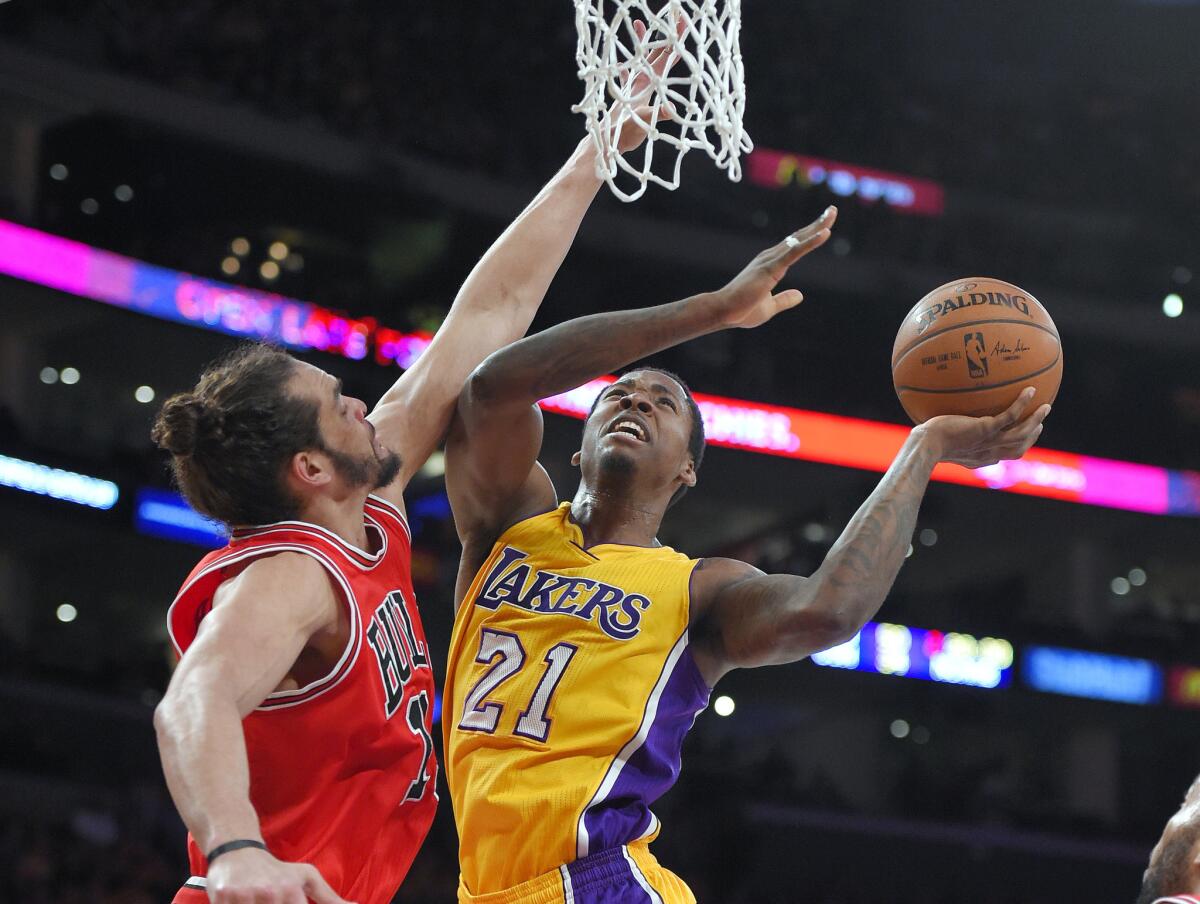 Lakers forward Ed Davis drives against Chicago Bulls center Joakim Noah on Jan. 29 at Staples Center.