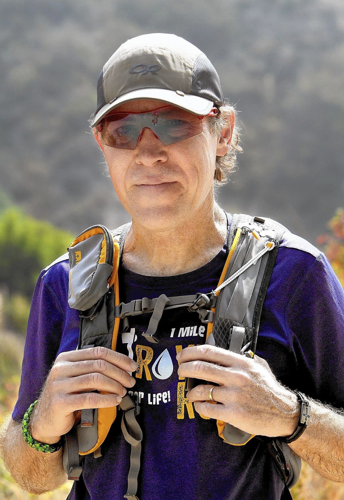 Roy Wiegand in a baseball cap and a purple T-shirt