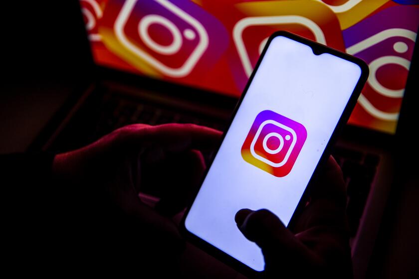 ANKARA, TURKIYE - NOVEMBER 14: In this photo illustration, logo of 'Instagram' is displayed on a mobile phone screen in front of a computer screen in Ankara, Turkiye on November 14, 2023. (Photo by Didem Mente/Anadolu via Getty Images)