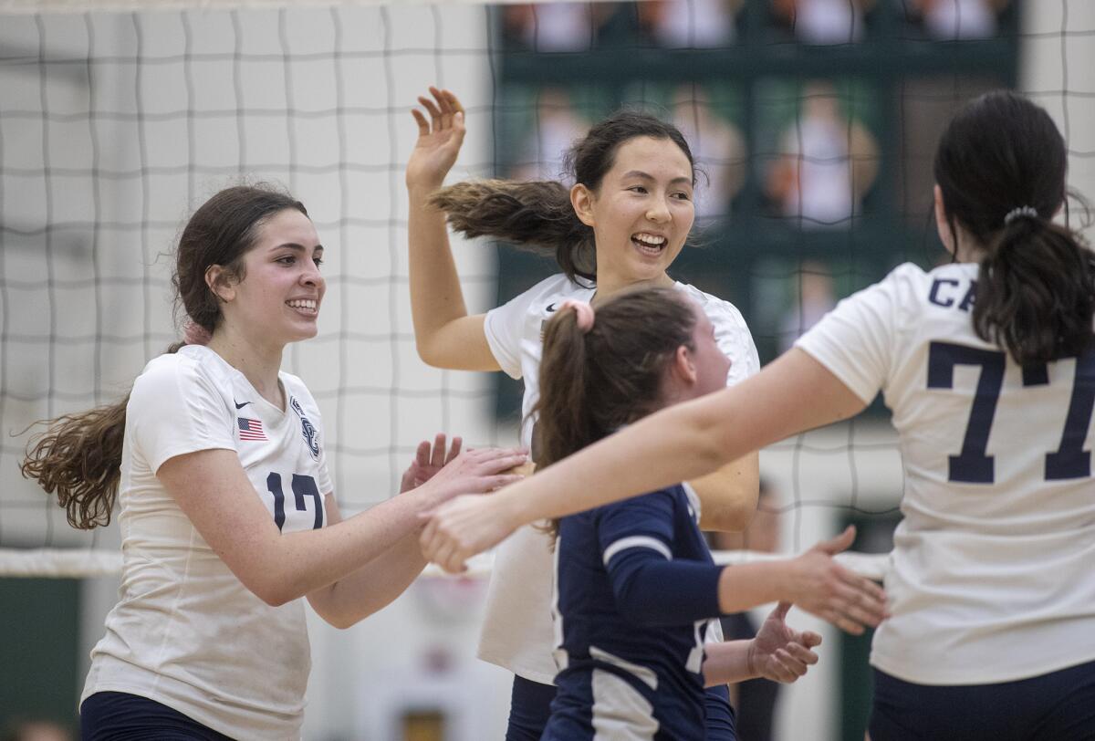 Calvary Chapel celebrates a point in Game 4 of an Orange Coast League match at Costa Mesa on Wednesday.