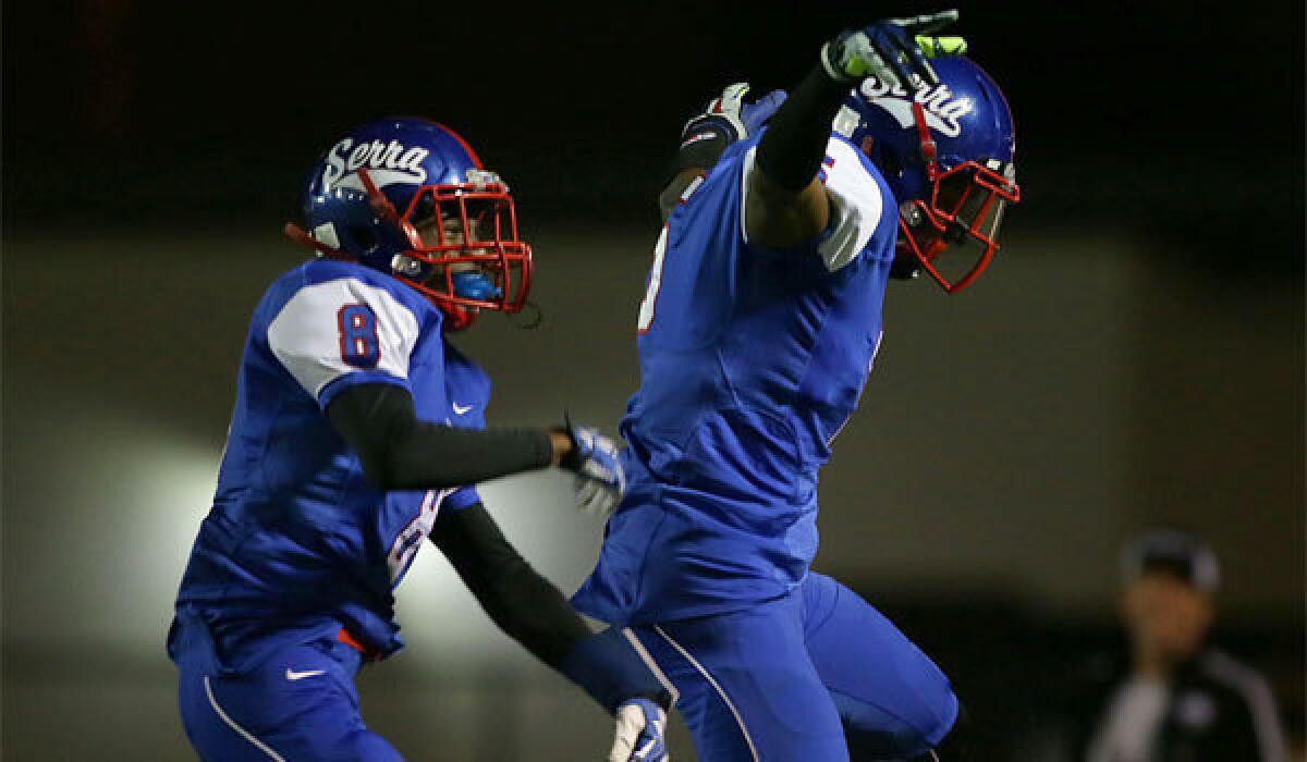 Serra receiver Jordan Lasley, right, and celebrates scoring a touchdown, with teammate Deontay Burnett.