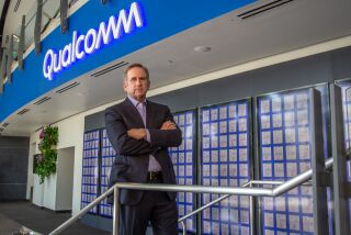 SAN DIEGO, CA - AUGUST 21: Executive Vice President and President of Qualcomm Technology Licensing, Alex Rogers stands in front of the company's patent wall at Qualcomm headquarters on Friday, Aug. 21, 2020 in San Diego, CA. (Jarrod Valliere / The San Diego Union-Tribune)