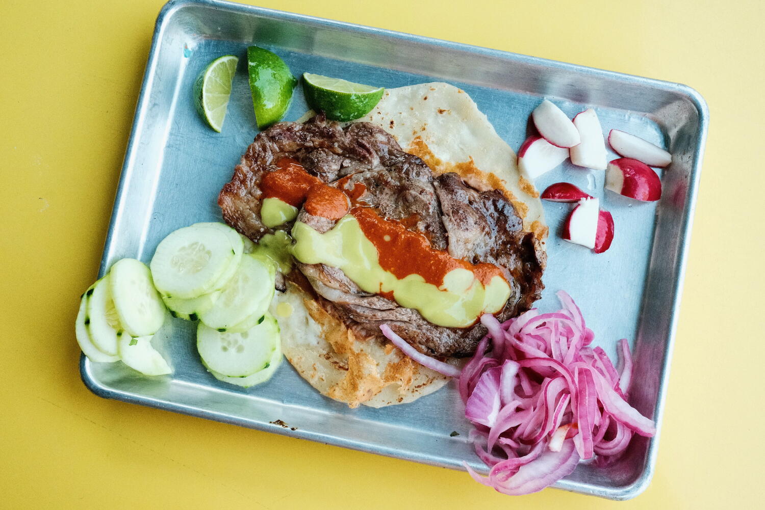 With fresh flour tortillas and mesquite meats, one of L.A.'s top taqueros debuts first restaurant