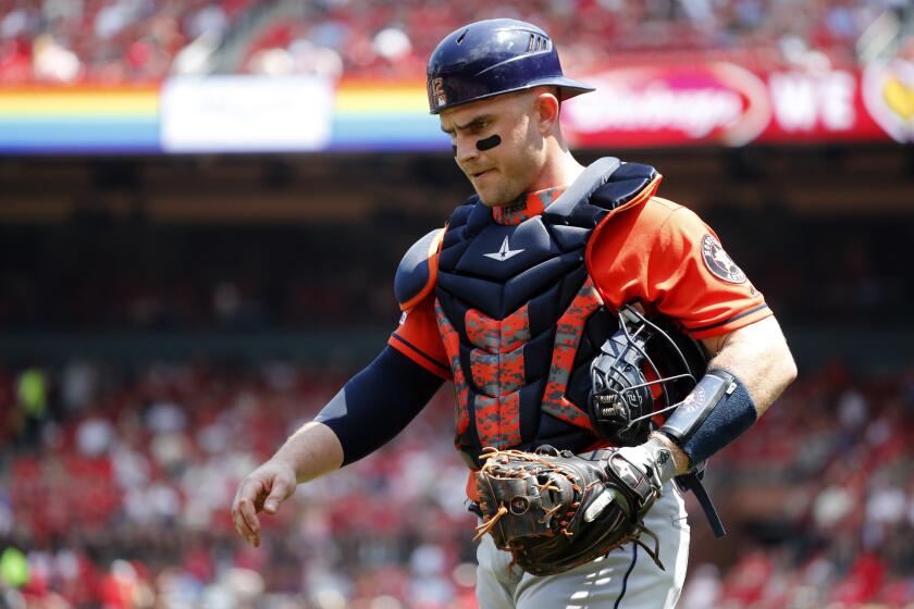 Houston Astros catcher Max Stassi walks off the field following the second inning of a baseball game against the St. Louis Cardinals Sunday, July 28, 2019, in St. Louis. (AP Photo/Jeff Roberson)