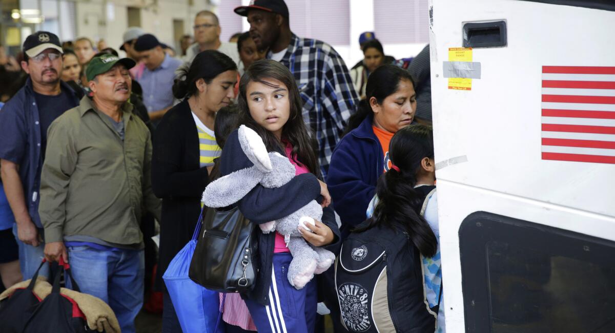 Immigrants from El Salvador and Guatemala board a bus after they were released from a family detention center in San Antonio last year.