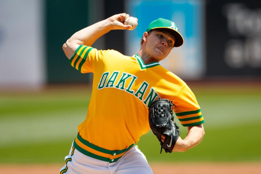 Athletics right-hander Sonny Gray (54) pitches against the Cubs during the first inning on Aug. 6.