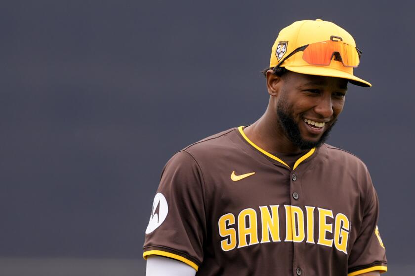 San Diego Padres' Jurickson Profar smiles before a spring training baseball game against the Cleveland Guardians, Monday, Feb. 26, 2024, in Peoria, Ariz. (AP Photo/Lindsey Wasson)