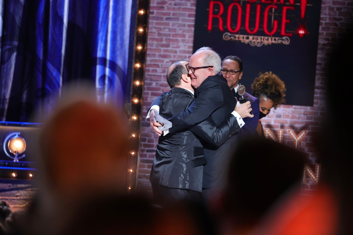 "Moulin Rouge!" performer Danny Burstein gets a congratulatory hug. 