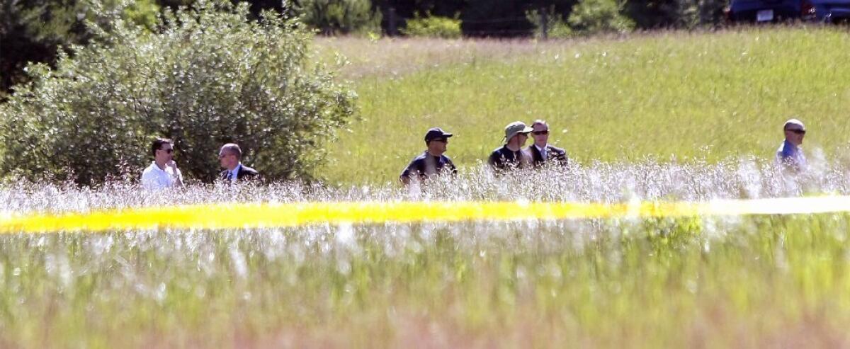 FBI agents search a field outside Detroit for the remains of Jimmy Hoffa.