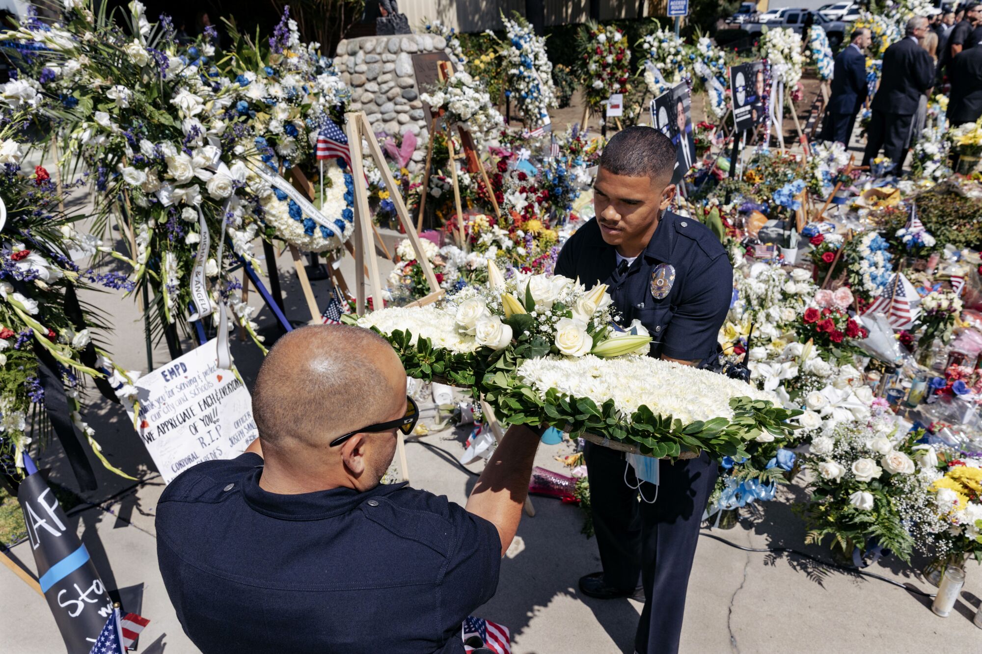 Officers lay a wreath outside the El Monte Police Department.
