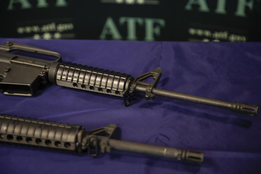 FILE - Homemade rifles are displayed on a table at an ATF field office in Glendale, Calif. in this Tuesday, Aug. 29, 2017, file photo. California's attorney general is suing the Trump administration in an effort to crack down on so-called "ghost guns" that can be built from parts with little ability to track or regulate the owner. (AP Photo/Jae C. Hong, File)