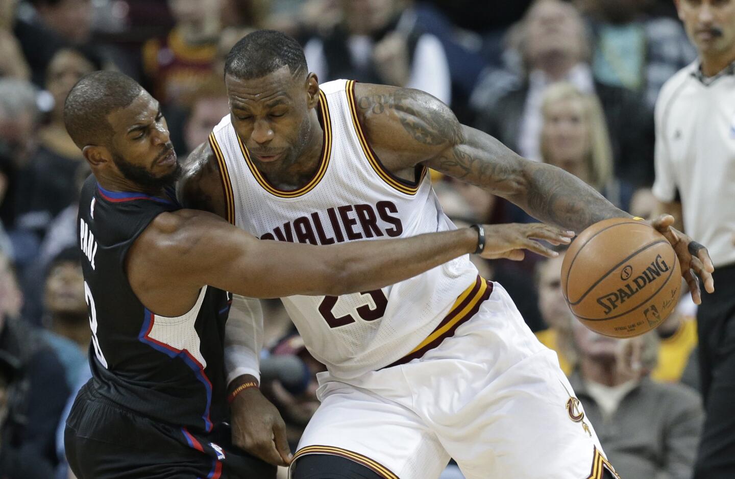 Clippers point guard Chris Paul tries to steal the ball from Cavaliers forward LeBron James during the second half.