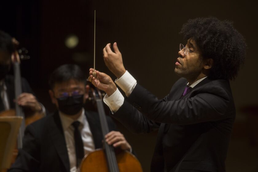 San Diego Symphony music director-conductor Rafael Payare leads the orchestra during a concert Friday