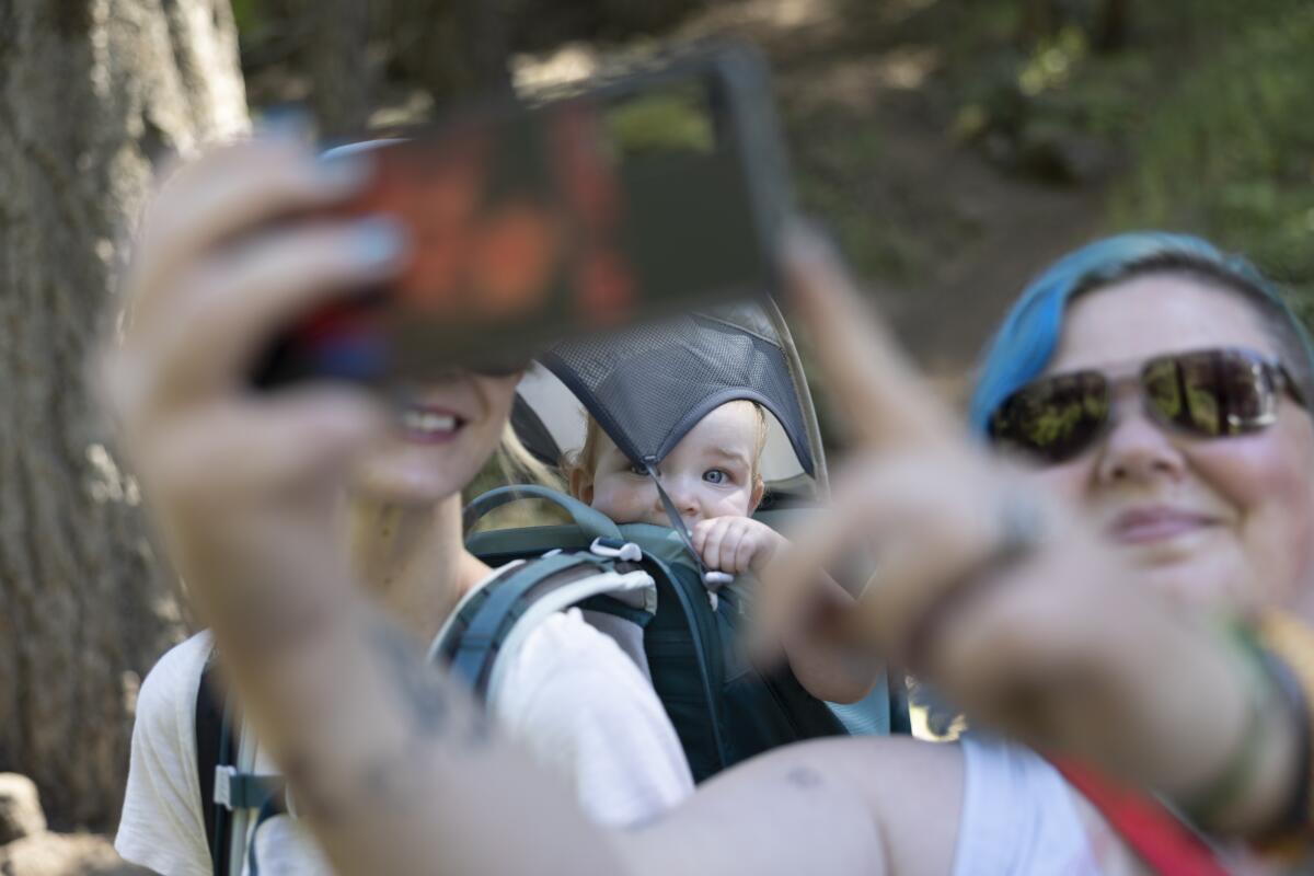 Rachel Brussbau poses with her baby and Crysten Michol in Burney Falls