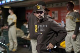 San Diego Padres manager Jayce Tingler stands in the dugout during the eighth inning of his team's baseball game against the San Francisco Giants in San Francisco, Friday, Oct. 1, 2021. (AP Photo/Jeff Chiu)