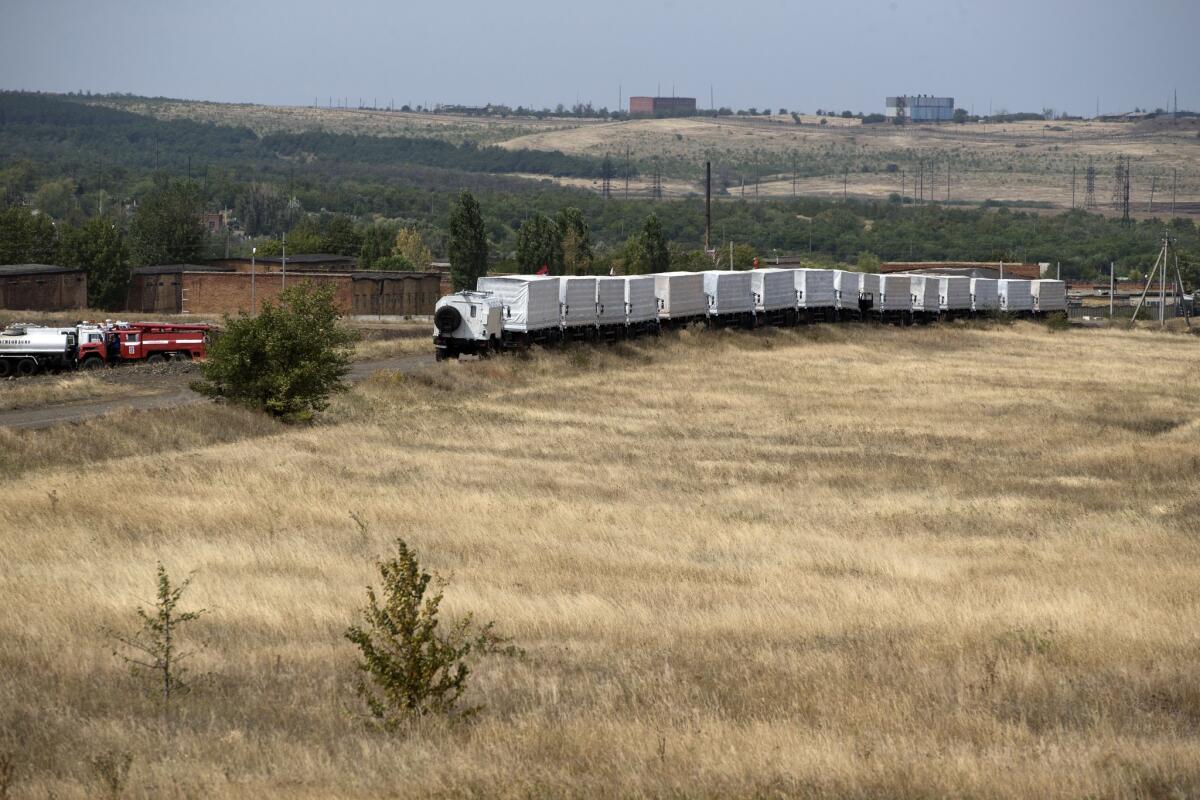 Part of a 280-vehicle Russian aid convoy waits 17 miles from the Ukrainian border on Aug. 18.