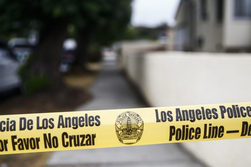 PACOIMA, CALIF. - MAY 30: Police Officers at the scene of an officer involved shooting near the 10900 block of Telfair Avenue, on Wednesday, May 30, 2018 in Pacoima, Calif. Officers were called at about 1 a.m to a home near Telfair Elementary School, to investigate a reported stabbing (Kent Nishimura / Los Angeles Times)