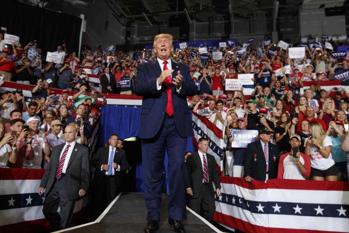 President Trump arrives to speak at a campaign rally July 17 at Williams Arena in Greenville, N.C.,