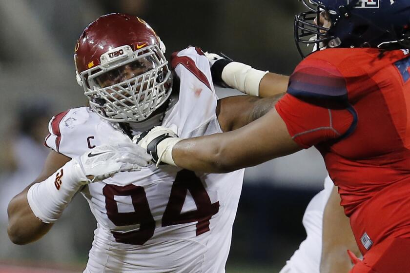 USC defensive end Leonard Williams tries to fight off a block during a Pac-12 Conference game against Arizona.