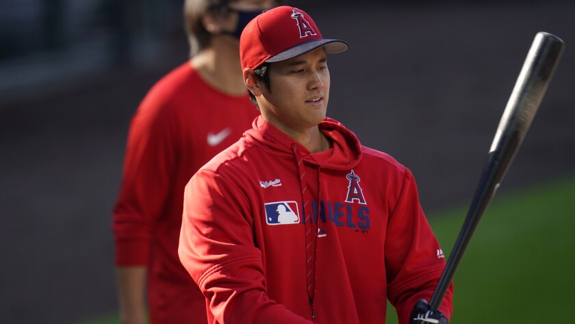 Angels' Shohei Ohtani warms up before a game against the Colorado Rockies.