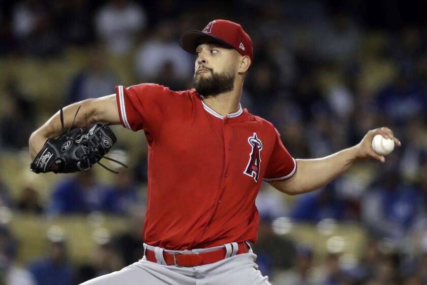Los Angeles Angels starting pitcher Patrick Sandoval throws to the Los Angeles Dodgers during the first inning of a preseason baseball game Tuesday, March 26, 2019, in Anaheim, Calif. (AP Photo/Marcio Jose Sanchez)