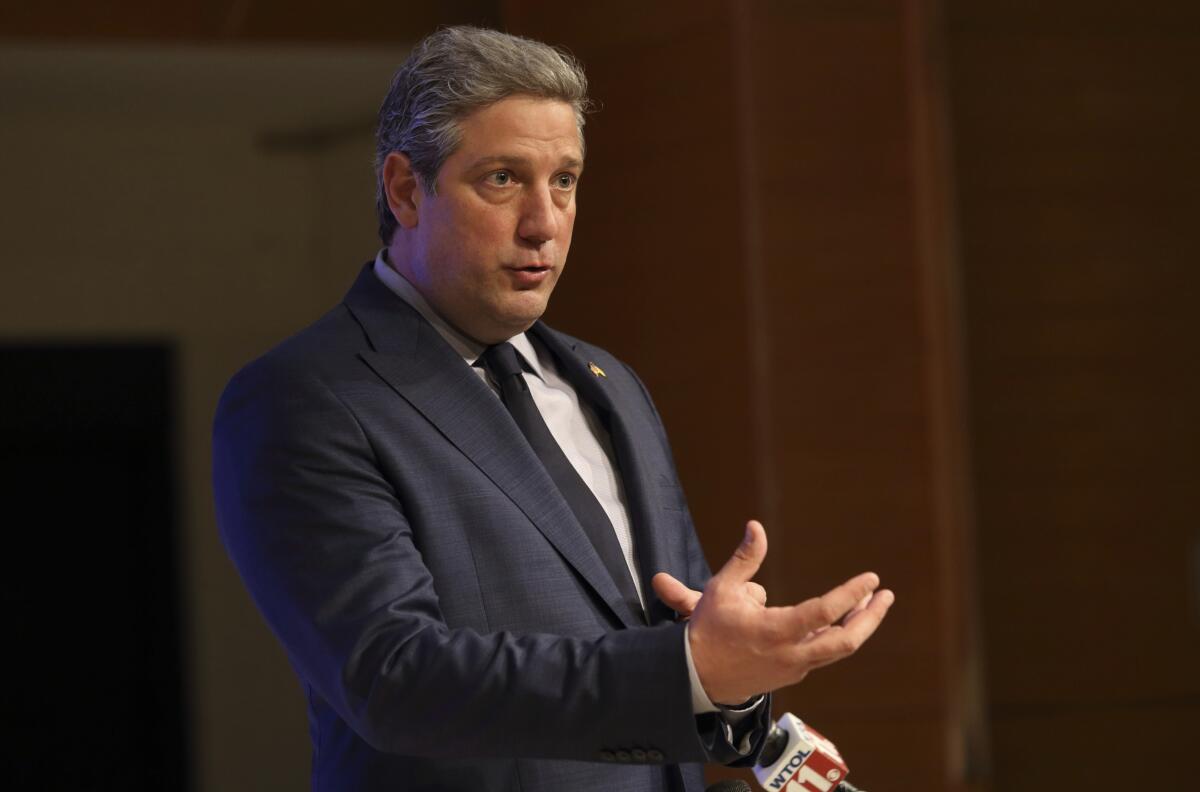 U.S. Rep. Tim Ryan talks with reporters following a debate with other Democrats.