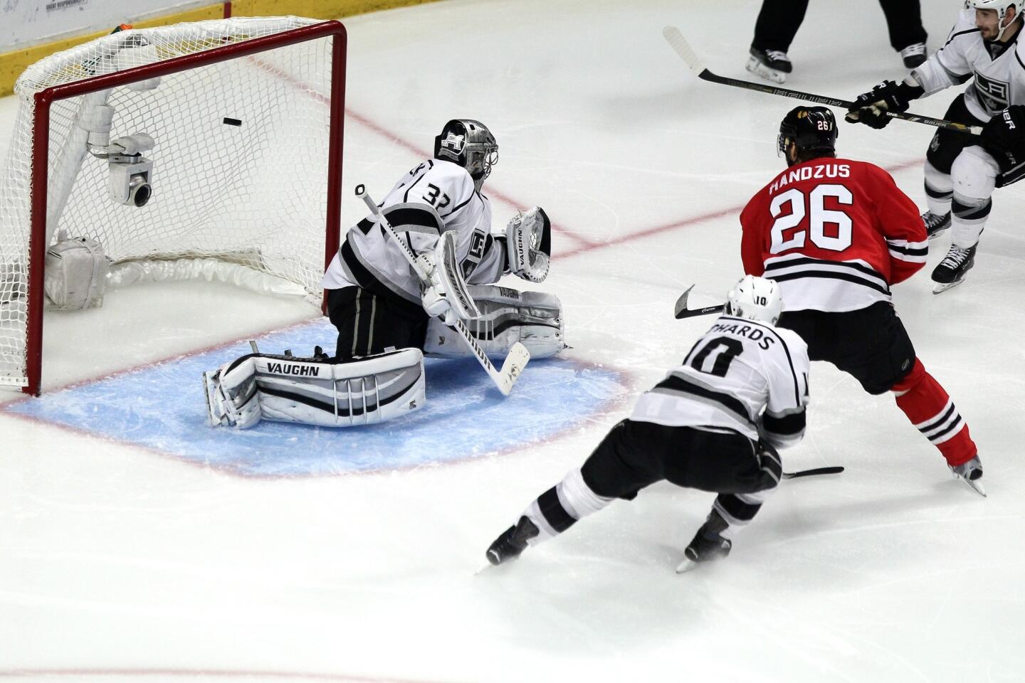 Chicago Blackhawks forward Michal Handzus, right, scores the winning goal past Kings goalie Jonathan Quick in double overtime in the Kings' 5-4 loss in Game 5 of the Western Conference finals.