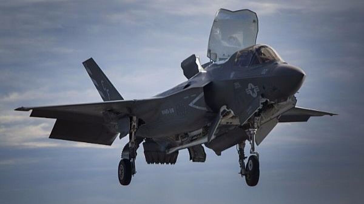 A Marine Corps F-35B lands on an amphibious ship in the Pacific.