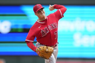 Los Angeles Angels starting pitcher Kenny Rosenberg delivers during the first inning.