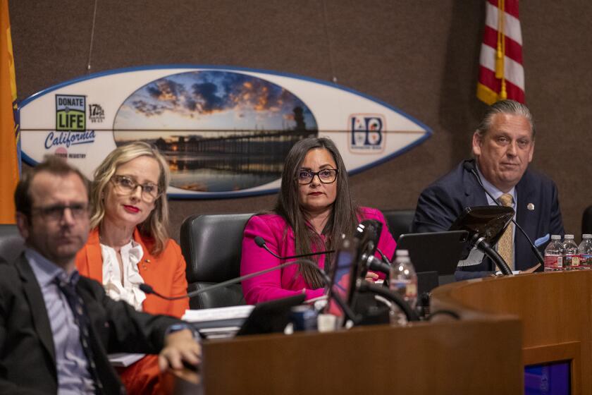 Huntington Beach, CA - June 20: Mayor pro tem Gracey Van Der Mark, center, listens to public comments during a Huntington Beach City Council meeting on Tuesday, June 20, 2023 in Huntington Beach, CA. Van Der Mark has introduced an agenda item that would filter out some books she deems obscene or pornographic that are currently available to children at the city's public libraries. (Scott Smeltzer / Daily Pilot)