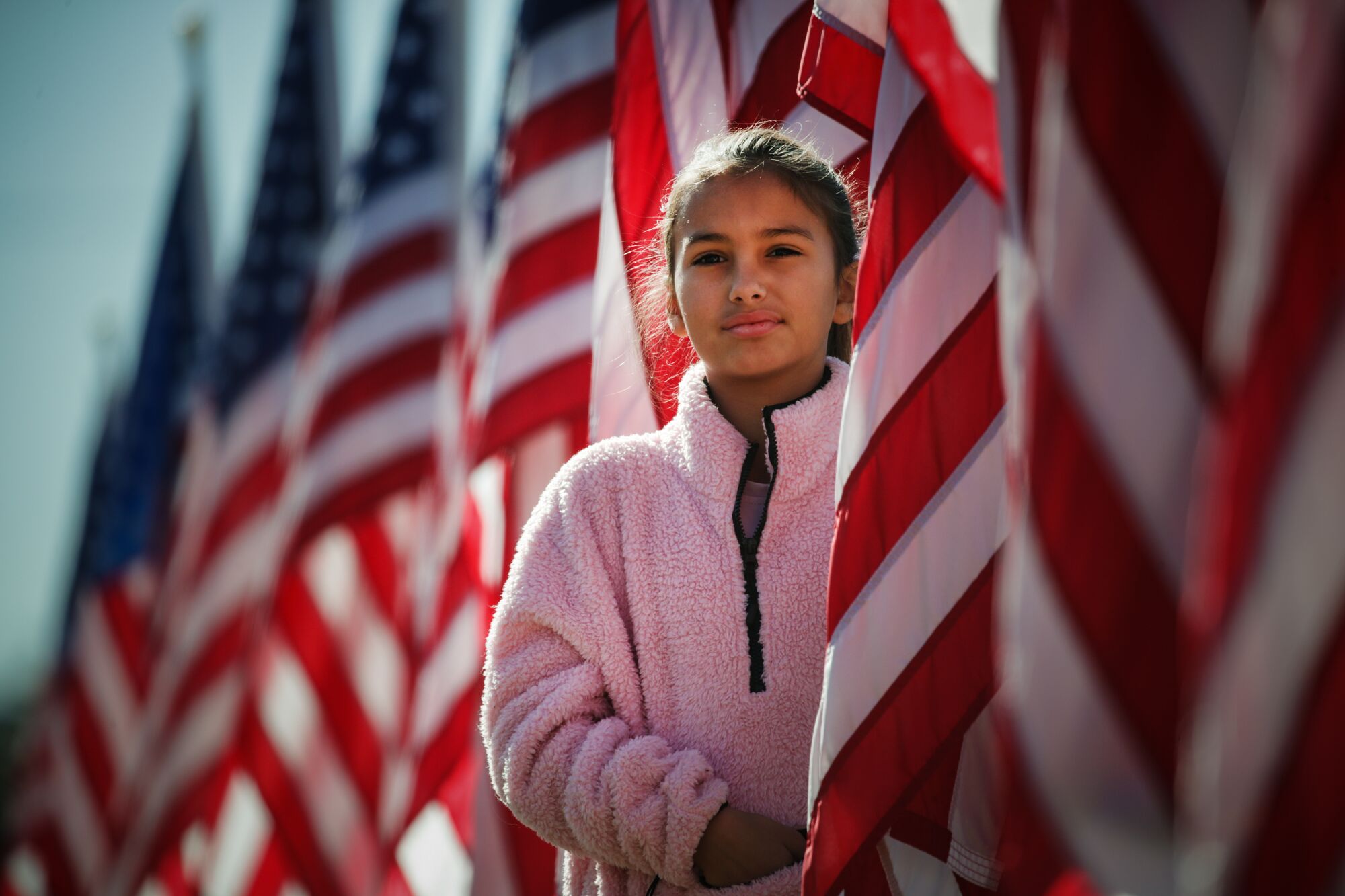 Kadence Belle visits Field of Valor, to honor troops and veterans on the grounds of Sierra Vista Middle School on Saturday.