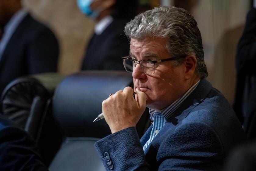 Los Angeles, CA - January 13: Tim McOsker, Los Angeles city council member from fifteenth district, listens to speakers City Council meeting held at city hall on Friday, Jan. 13, 2023 in Los Angeles, CA. (Irfan Khan / Los Angeles Times)