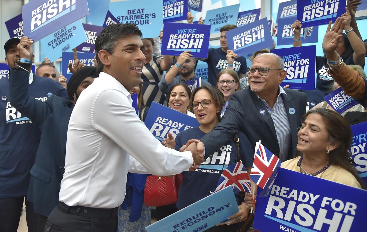 Rishi Sunak shaking hands in a crowd of supporters