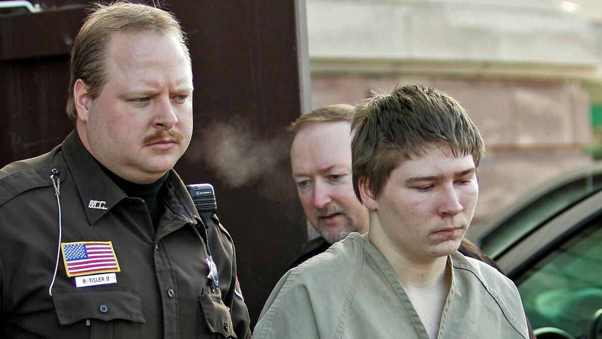 Brendan Dassey is escorted out of a courtroom in Manitowoc, Wis., in 2006.