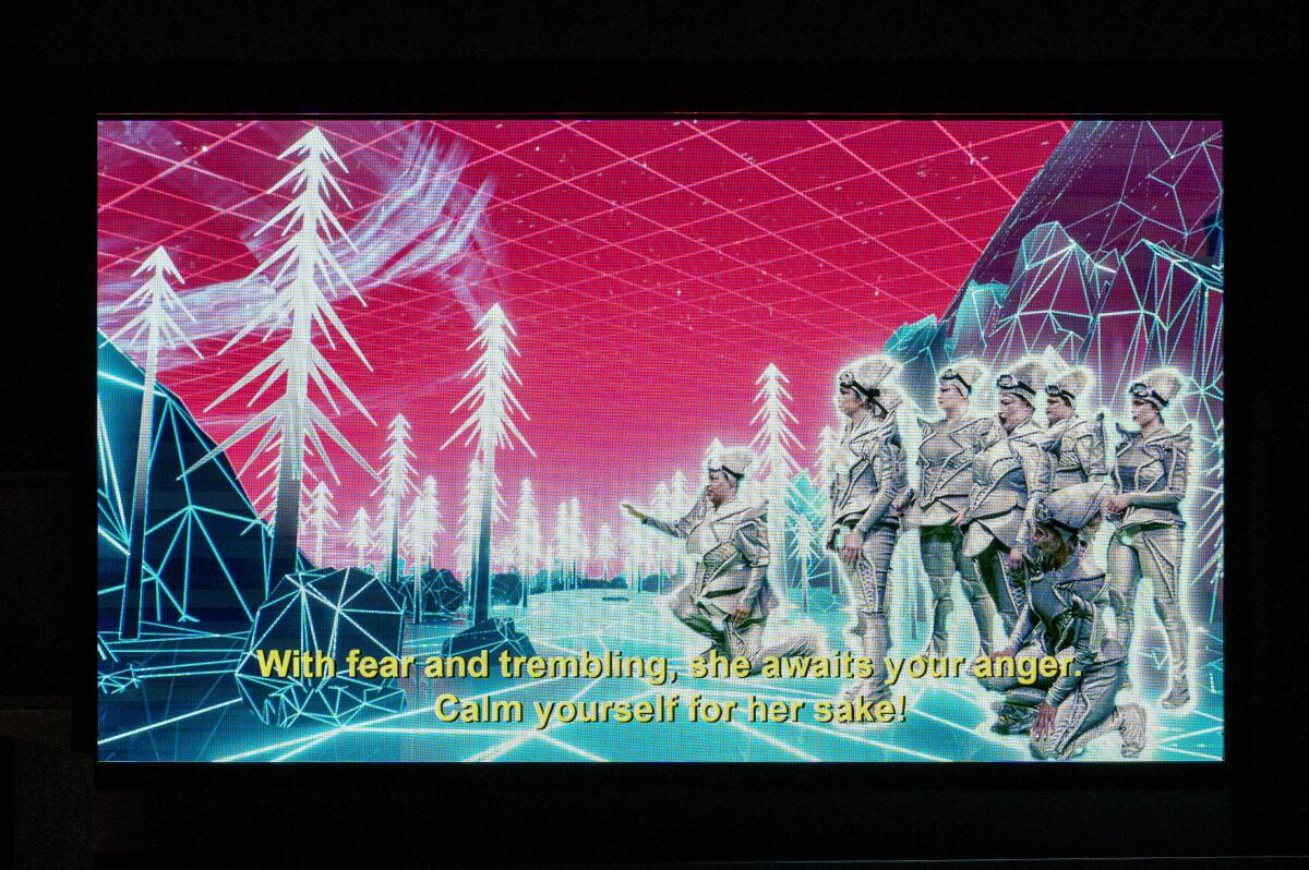 A digital screen shows figures in a futuristic forest.