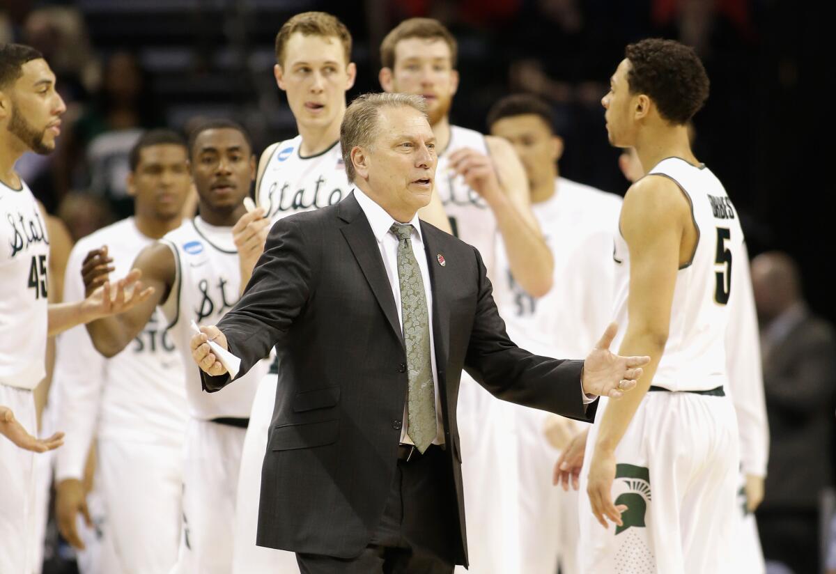Michigan State Coach Tom Izzo gathers his players during a timeout during their NCAA tournament victory over Georgia on March 20.