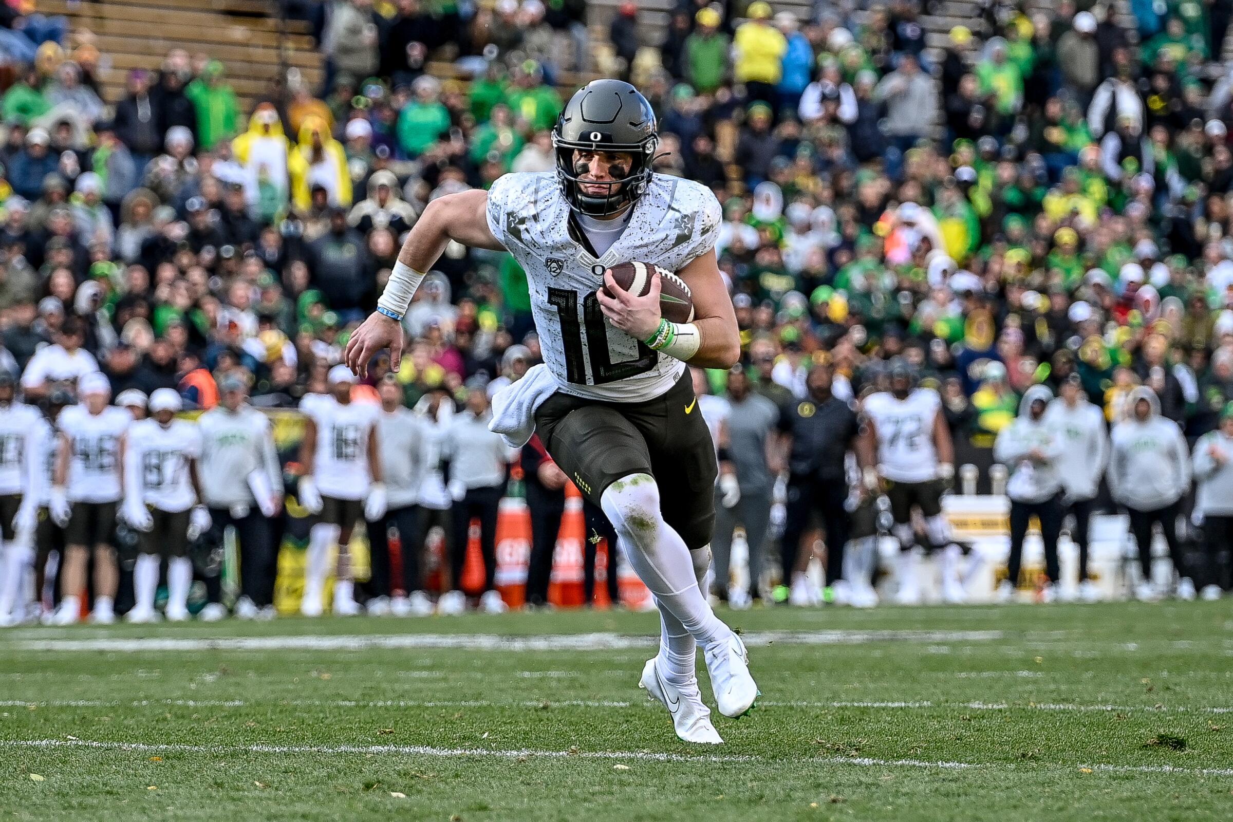 Oregon quarterback Bo Nix carries the ball during a win over Colorado on Nov. 5.