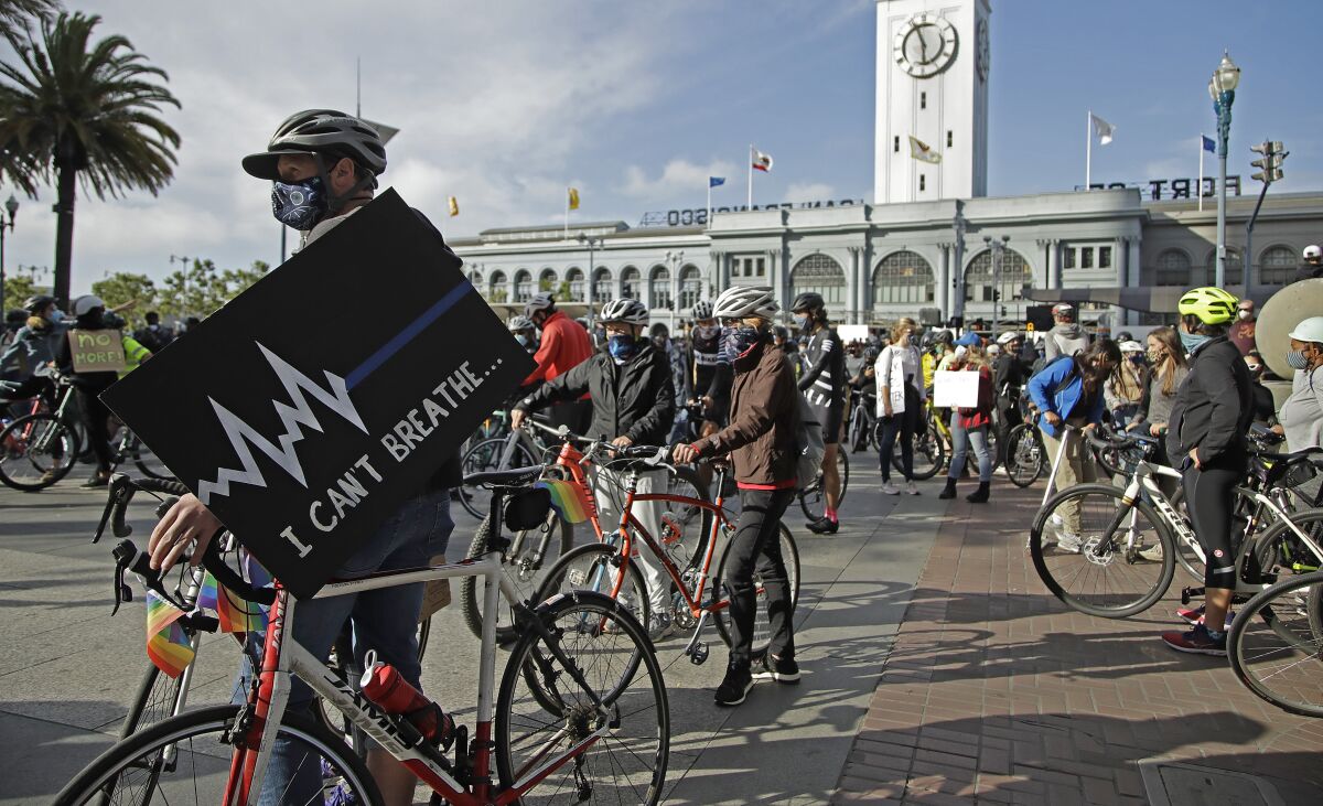 Cyclists participate in a George Floyd solidarity ride June 5 in San Francisco. 