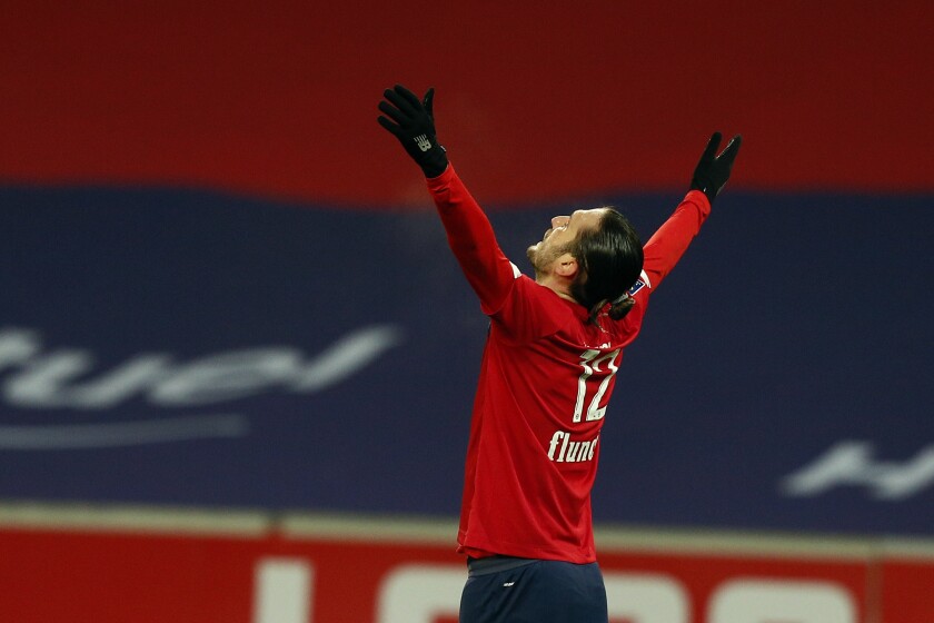 Lille's Yusuf Yazici celebrates his side's first goal during the French League One soccer match between Lille and Dijon at the Stade Pierre Mauroy stadium in Villeneuve d'Ascq, northern France, Sunday, Jan. 31, 2021. (AP Photo/Michel Spingler)